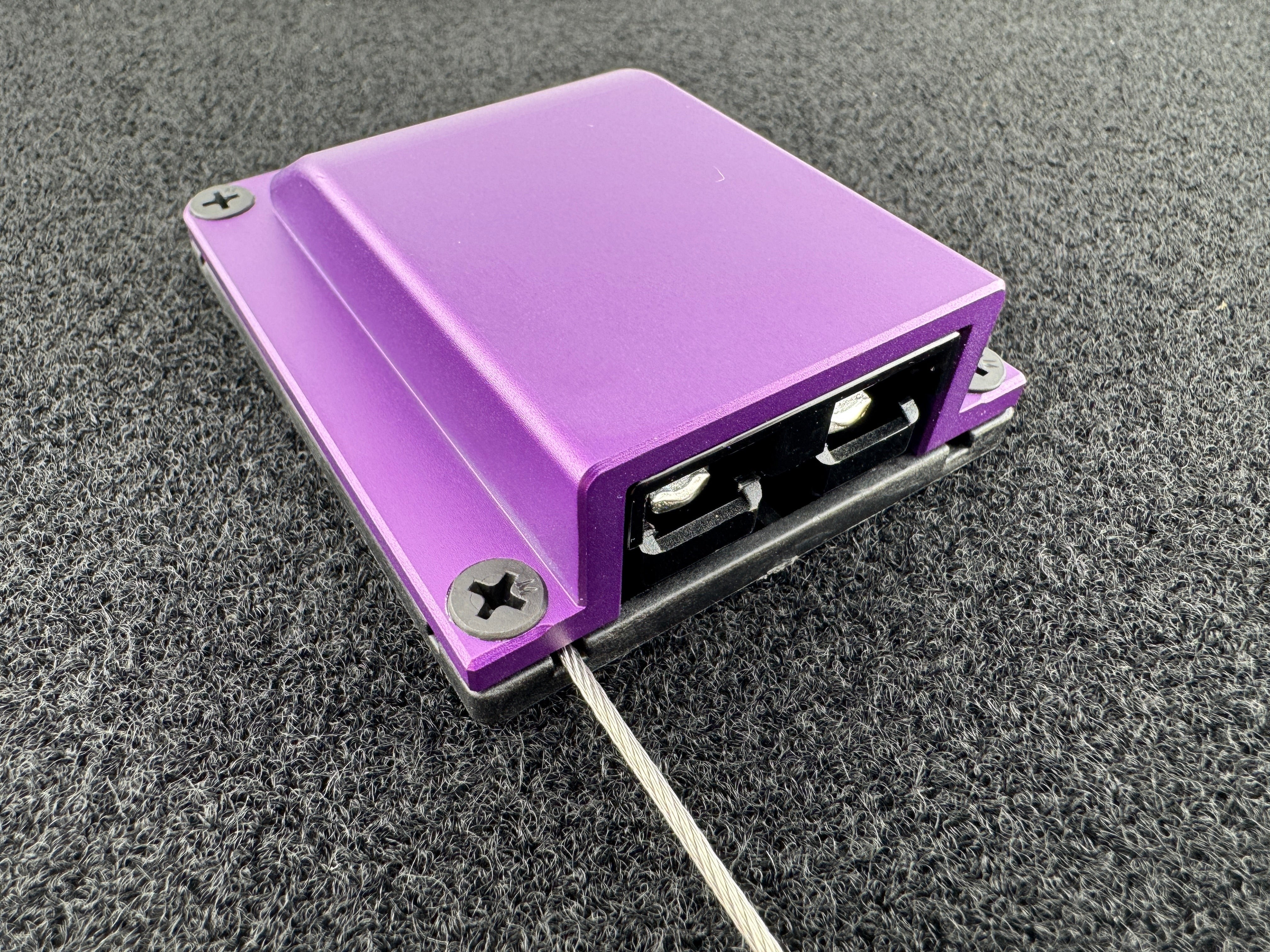 Duskie purple anodised aluminium housing for 2-way 50A connector, with dust cap and wire rope.