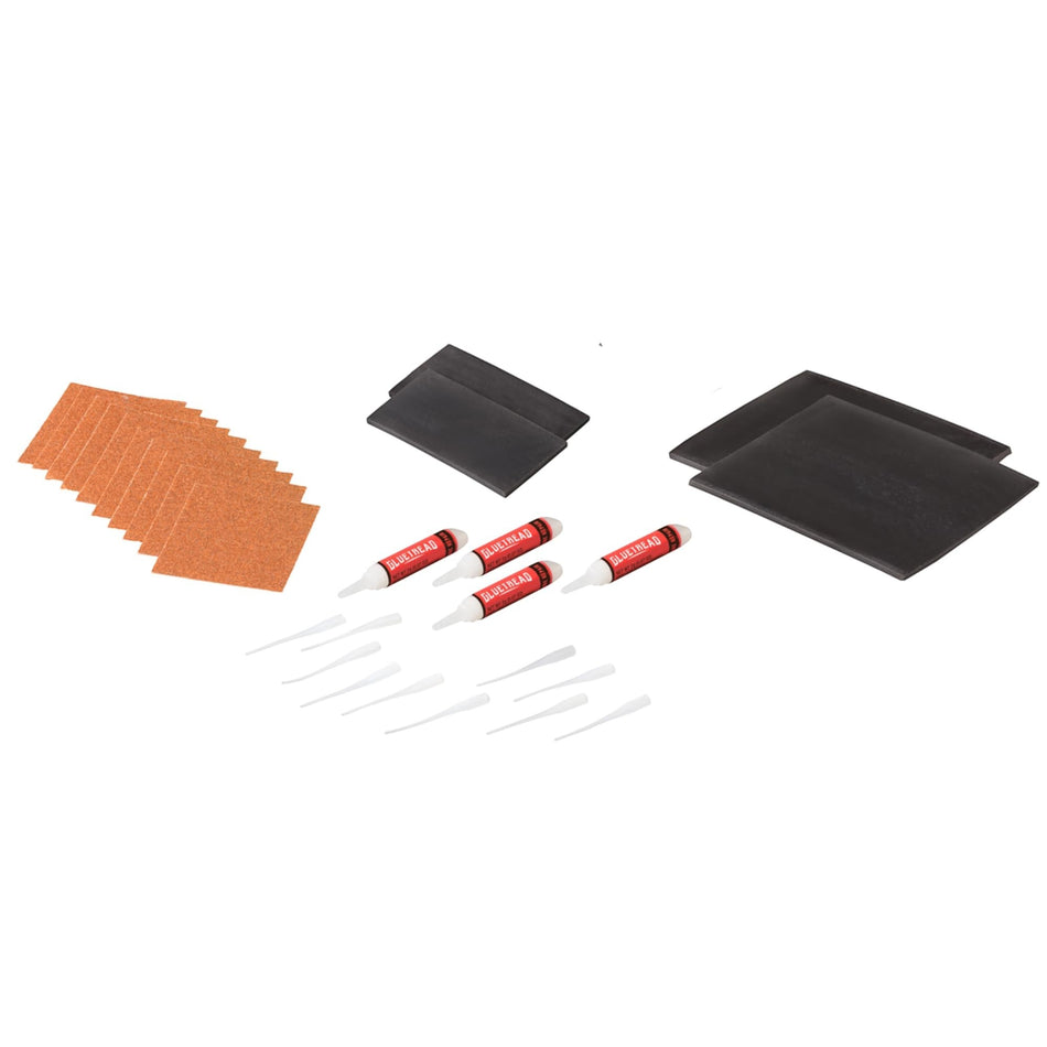 Duskie GlueTread off-road tire sidewall repair kit with rubber patches, adhesive tubes, and sandpaper squares.