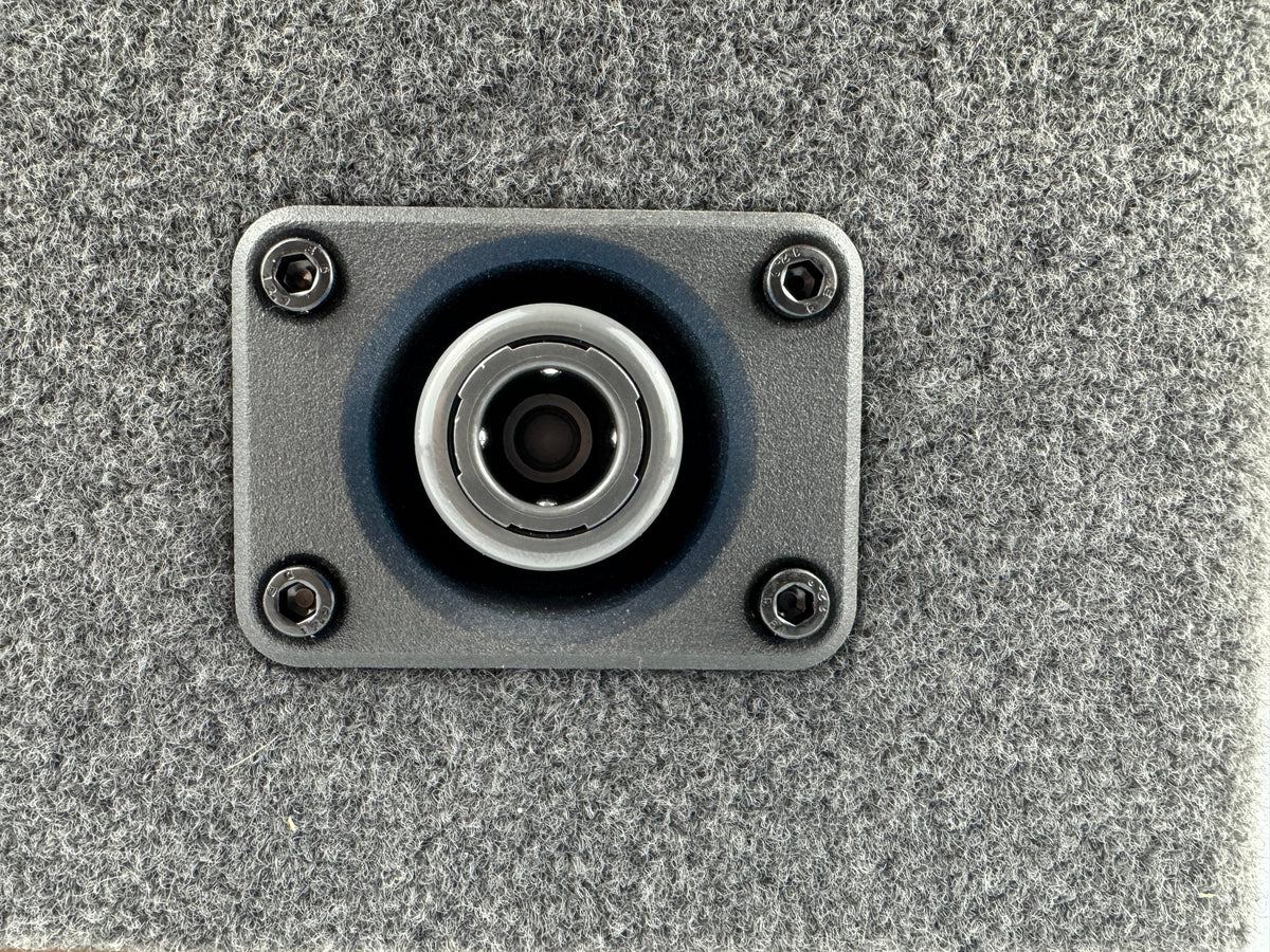 Duskie Nitto Legris coupler with panel kit and 12mm barb, silver metal coupler with blue rubber seal on grey textured panel.