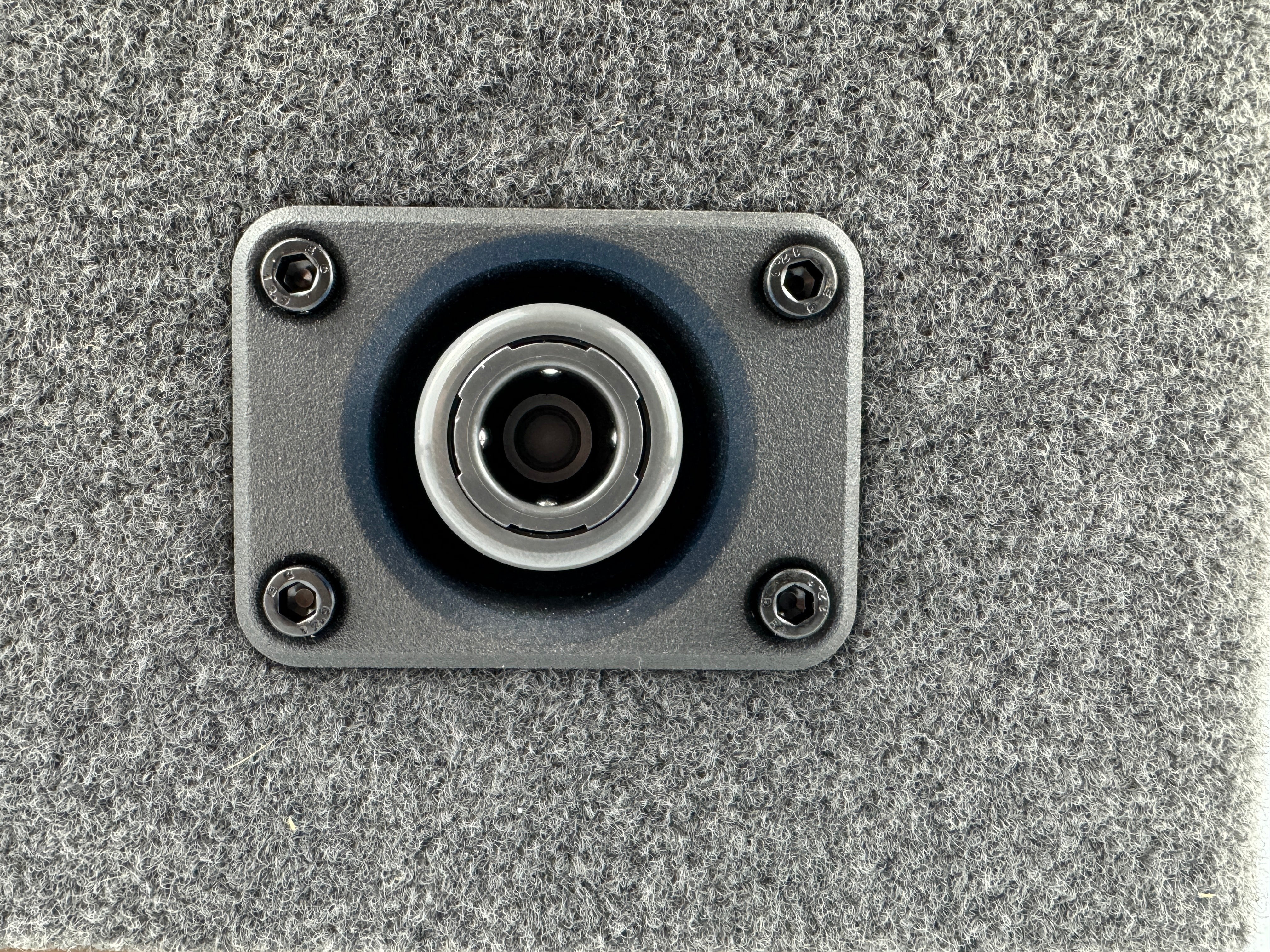Duskie Nitto Legris coupler with panel kit and 12mm barb, silver metal coupler with blue rubber seal on grey textured panel.