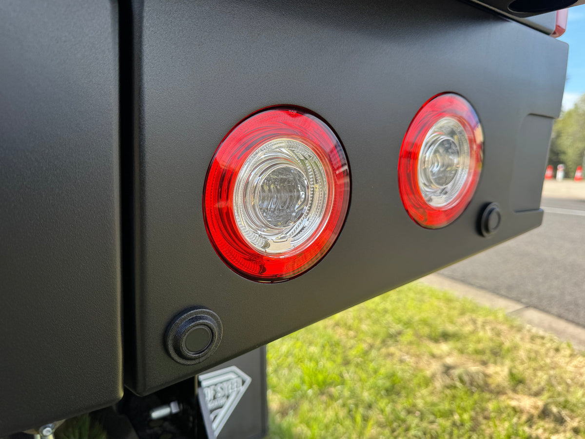 Duskie black nylon sensor relocator housings for Toyota Hilux 2026+ tray and canopy integration. Flush mount design.
