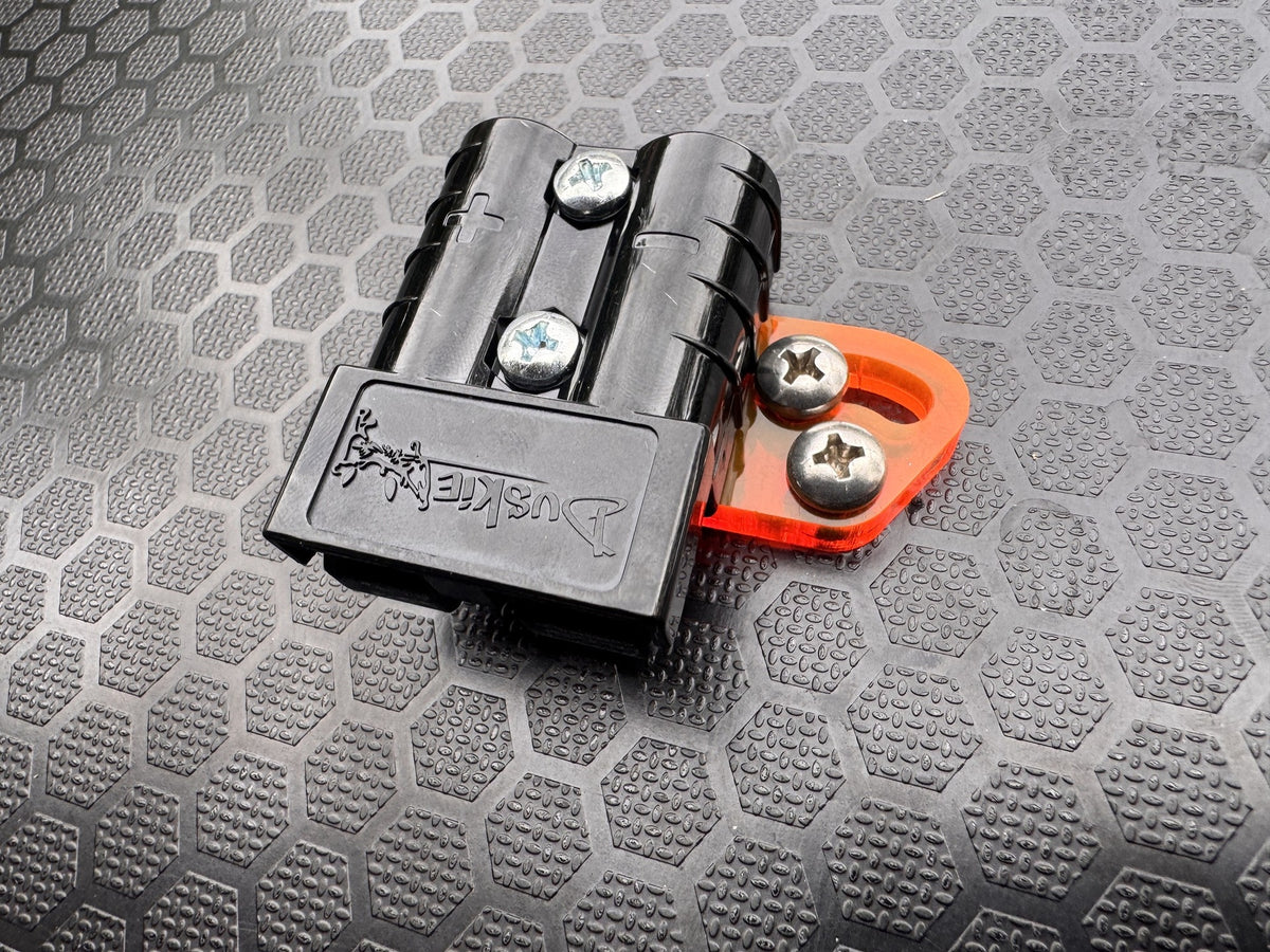 RICK 50A connector with orange acrylic bracket assembled, shown at an angle.