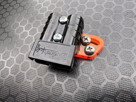 RICK 50A connector with orange acrylic bracket assembled, shown at an angle.